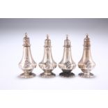 ^ A SET OF FOUR GEORGE V SILVER PEPPERS, by Carrington & Co, London 1911, each with presentation