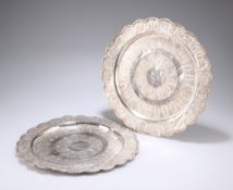 ^ TWO MALAYSIAN SILVER TRAYS, each of scalloped circular form, the first engraved "Presented to