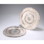 ^ TWO MALAYSIAN SILVER TRAYS, each of scalloped circular form, the first engraved "Presented to