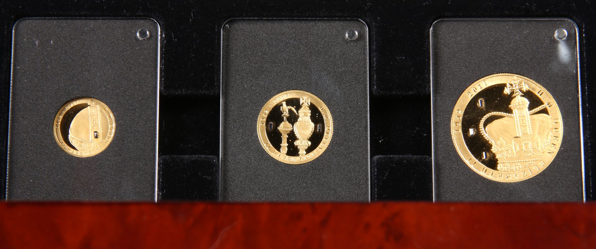 AN ELIZABETH II SAPPHIRE JUBILEE THREE COIN GOLD PROOF SET, comprising half crown, quarter crown and