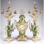 A GILT-METAL MOUNTED GREEN-GLAZED POTTERY CLOCK GARNITURE, comprising balloon clock with two-train