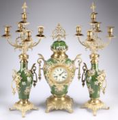 A GILT-METAL MOUNTED GREEN-GLAZED POTTERY CLOCK GARNITURE, comprising balloon clock with two-train