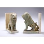 A PAIR OF 20TH CENTURY CARVED ONYX LION BOOKENDS, modelled as seated lions against book backs.