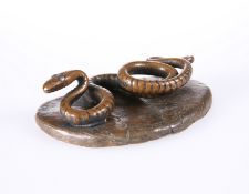 AN UNUSUAL PATINATED METAL MODEL OF A SNAKE, CIRCA 1900