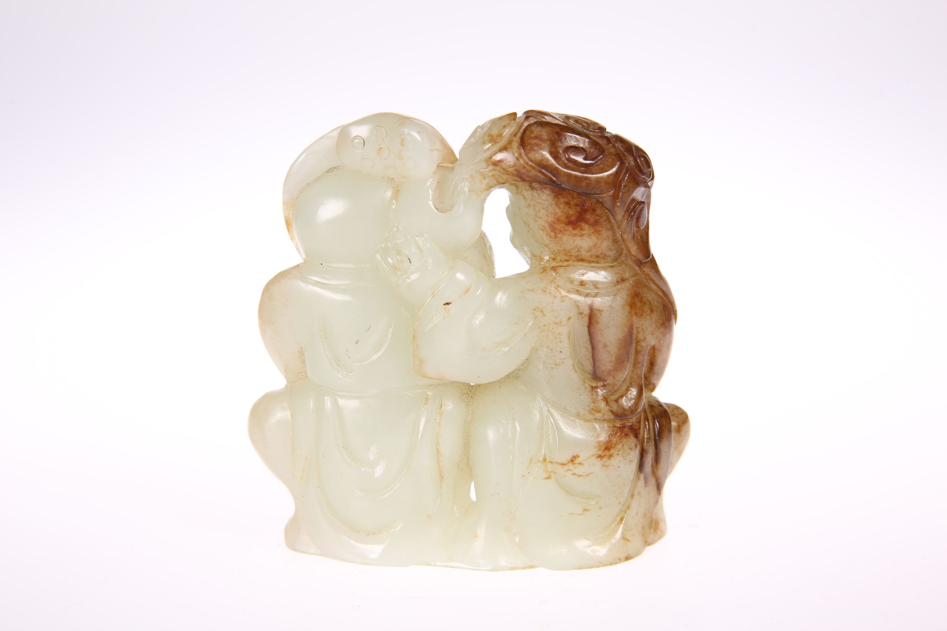 A CHINESE PALE GREEN AND RUSSET JADE 'HE-HE ER XIAN' GROUP, probably 18th Century, the twins with - Bild 2 aus 2