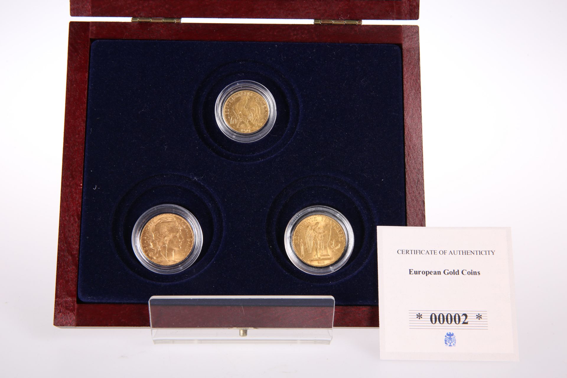 THREE FRENCH GOLD COINS, comprising 1877 twenty francs, 1901 ten francs and 1909 twenty francs. (3)