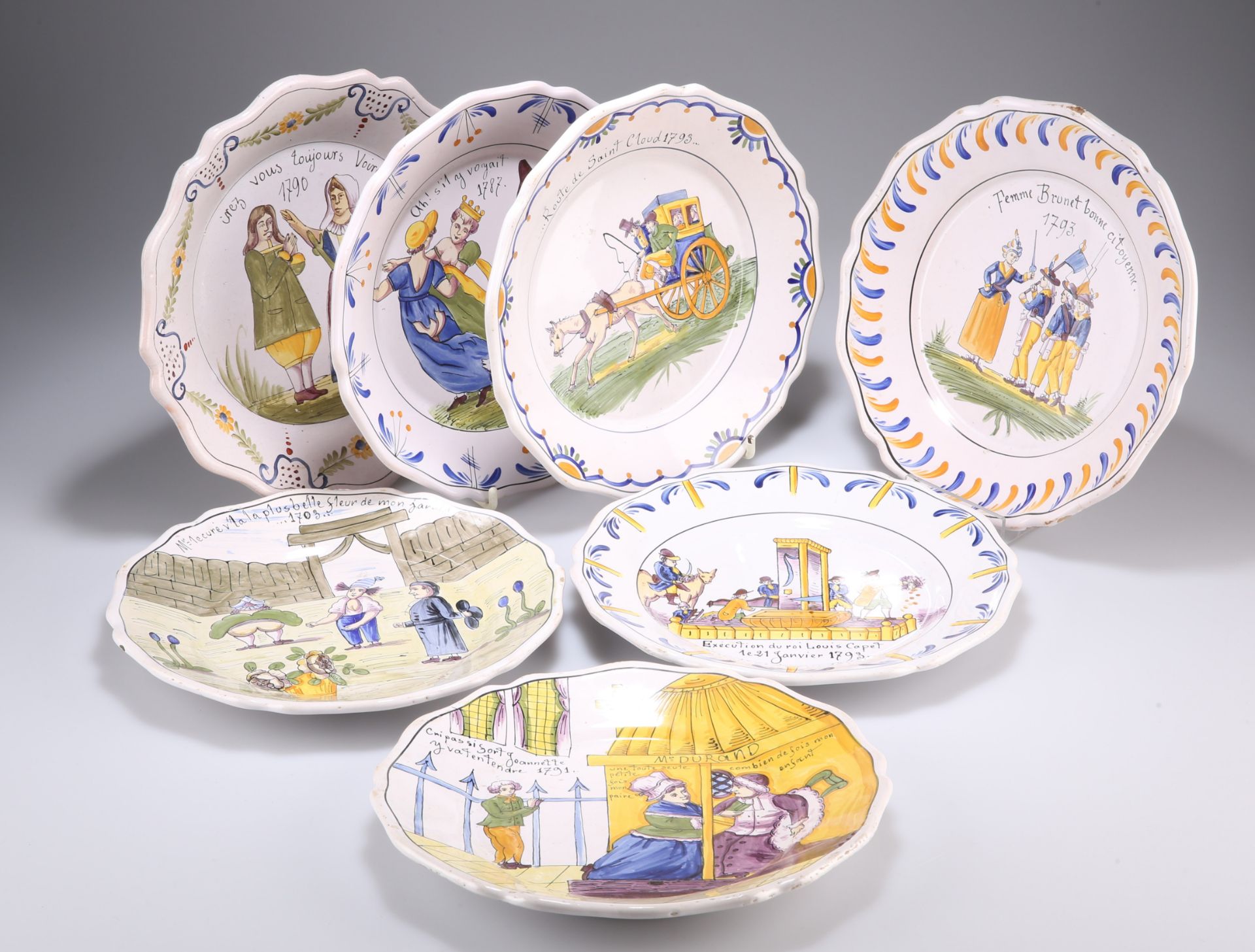 A GROUP OF SEVEN 'FRENCH REVOLUTION' COMMEMORATIVE FAIENCE PLATES, each of shaped circular form.