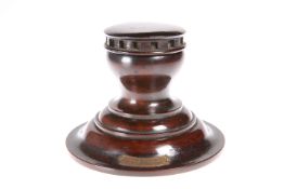 TREEN: A CAPSTAN INKWELL CONSTRUCTED FROM TIMBER TAKEN FROM HMS BRITANNIA, with attached brass