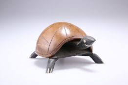 AN UNUSUAL CARVED COCONUT TURTLE, with nodding head, the coconut forming the shell. 11.5cm at widest