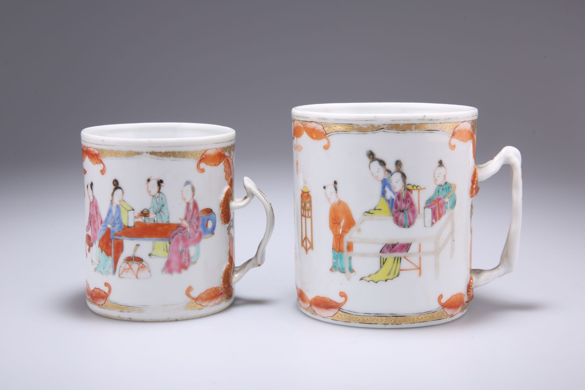 TWO CHINESE FAMILLE ROSE TANKARDS, each cylindrical with moulded lotus tendril handles, enamel