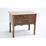 A GEORGE III MAHOGANY LOWBOY, the moulded rectangular top above a long drawer over a pair of short