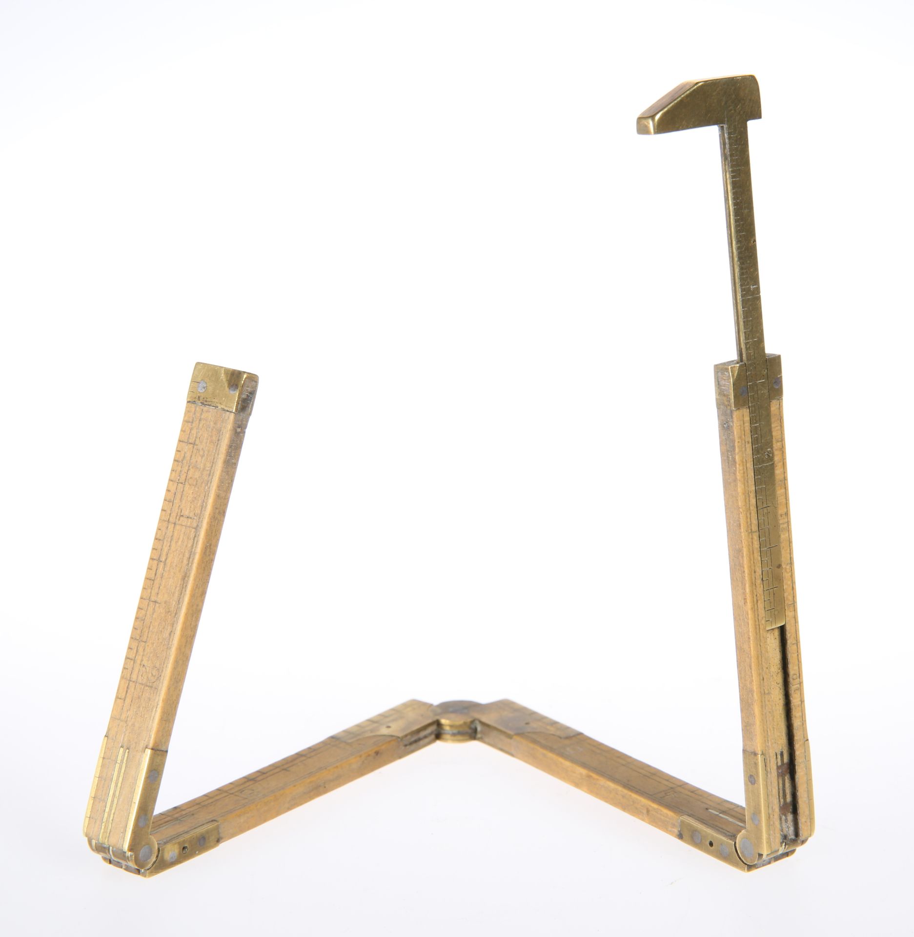 A BRASS-MOUNTED TWELVE INCH FOLDING FOUR-SECTION RULE WITH GAUGE, by E. Prestons & Sons,