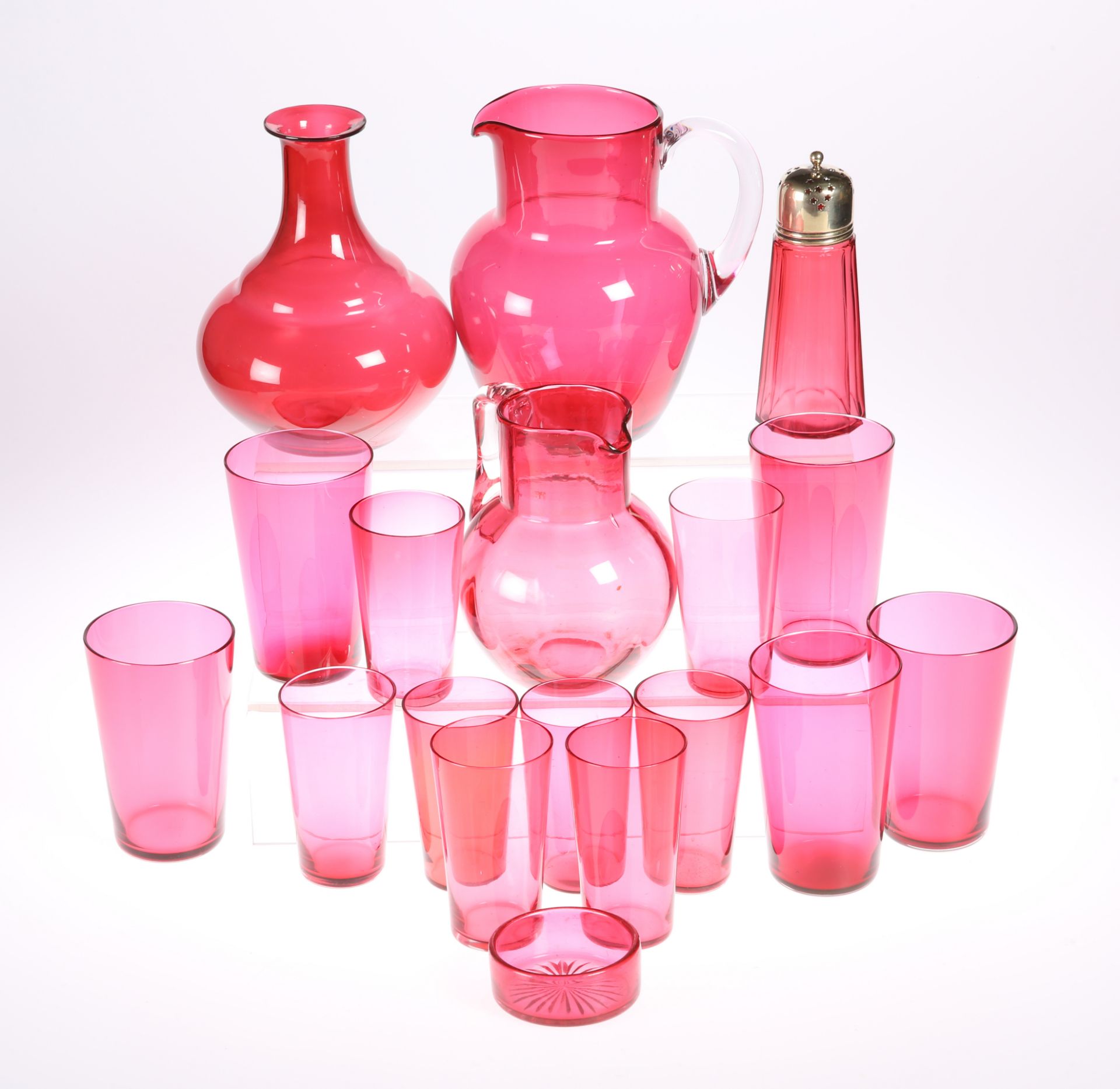 A COLLECTION OF VICTORIAN CRANBERRY GLASS, comprising two pitchers, carafe, thirteen tumblers,