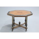 AN AESTHETIC EBONISED AND GILDED BURR YEW CENTRE TABLE, the moulded octagonal top raised on fluted