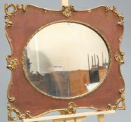 A PARCEL-GILT OAK MIRROR, 19TH CENTURY, cartouche shaped with oval mirror plate. 57.5cm by 67.5cm