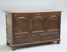 ~ AN OAK MULE CHEST, LATE 17TH/EARLY 18TH CENTURY, the moulded top above a front of three ogee