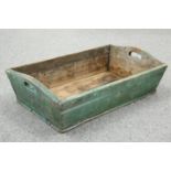 A VICTORIAN PAINTED TRUG, with cut-out handles. 76.5cm long