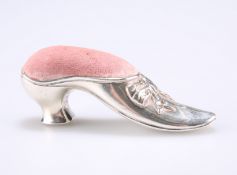 A SILVER SHOE PIN CUSHION, hallmarked Sterling, in the form of a dress shoe with velvet lined pin