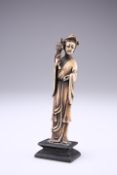 A CHINESE BONE FIGURE OF AN IMMORTAL, LATE 19TH CENTURY, carved standing in voluminous robes and