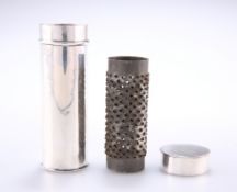 A NUTMEG GRATER TUBE HOLDER, the white metal tube of cylindrical form with removable lid, containing
