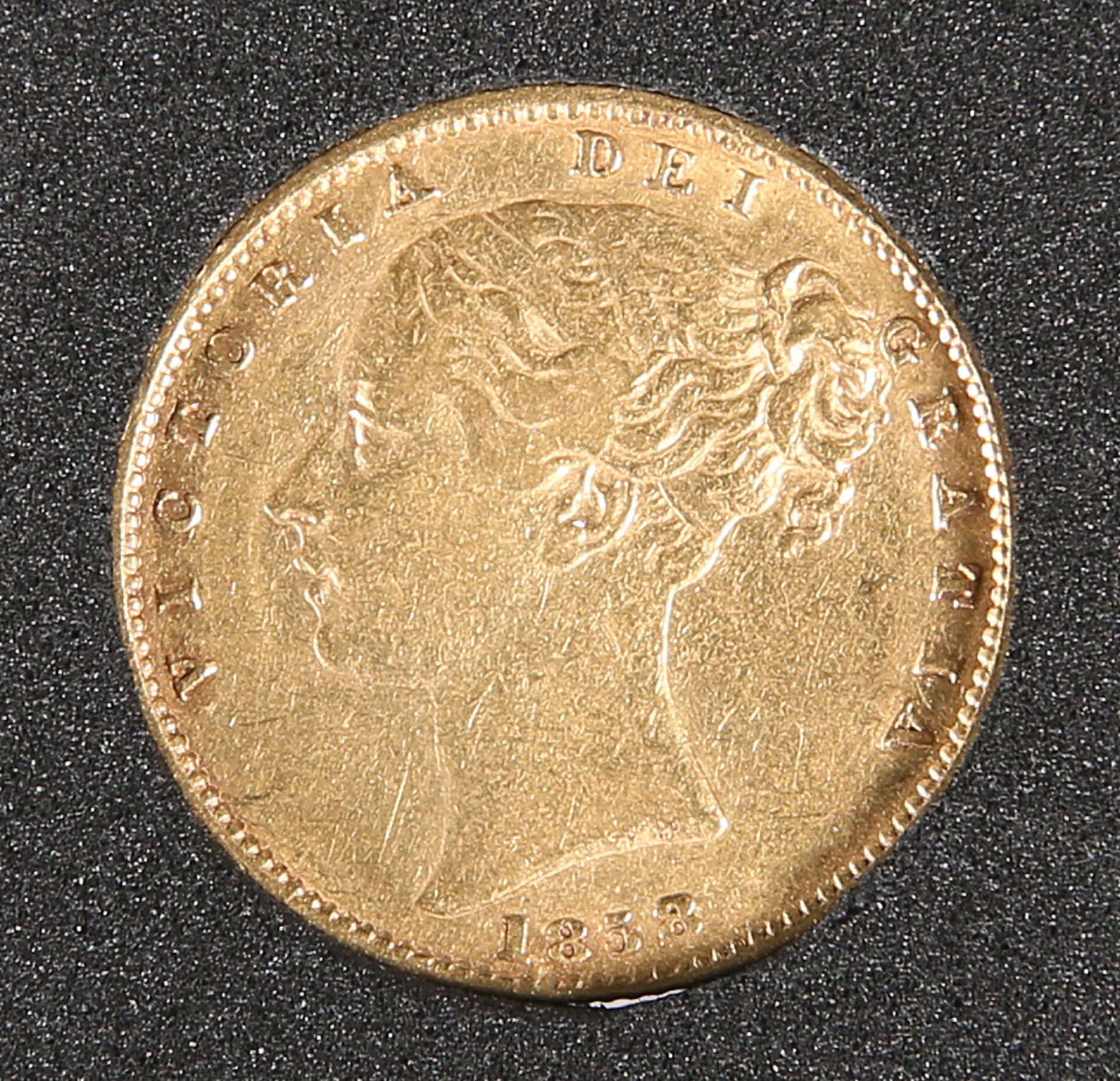 AN 1858 FULL SOVEREIGN.