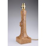 ROBERT THOMPSON OF KILBURN A MOUSEMAN OAK TABLE LAMP with tapering octagonal stem and square base