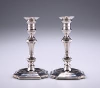 A MATCHED PAIR OF VICTORIAN SILVER TAPER STICKS, makers marks rubbed, Sheffield 1893 and 1898, of