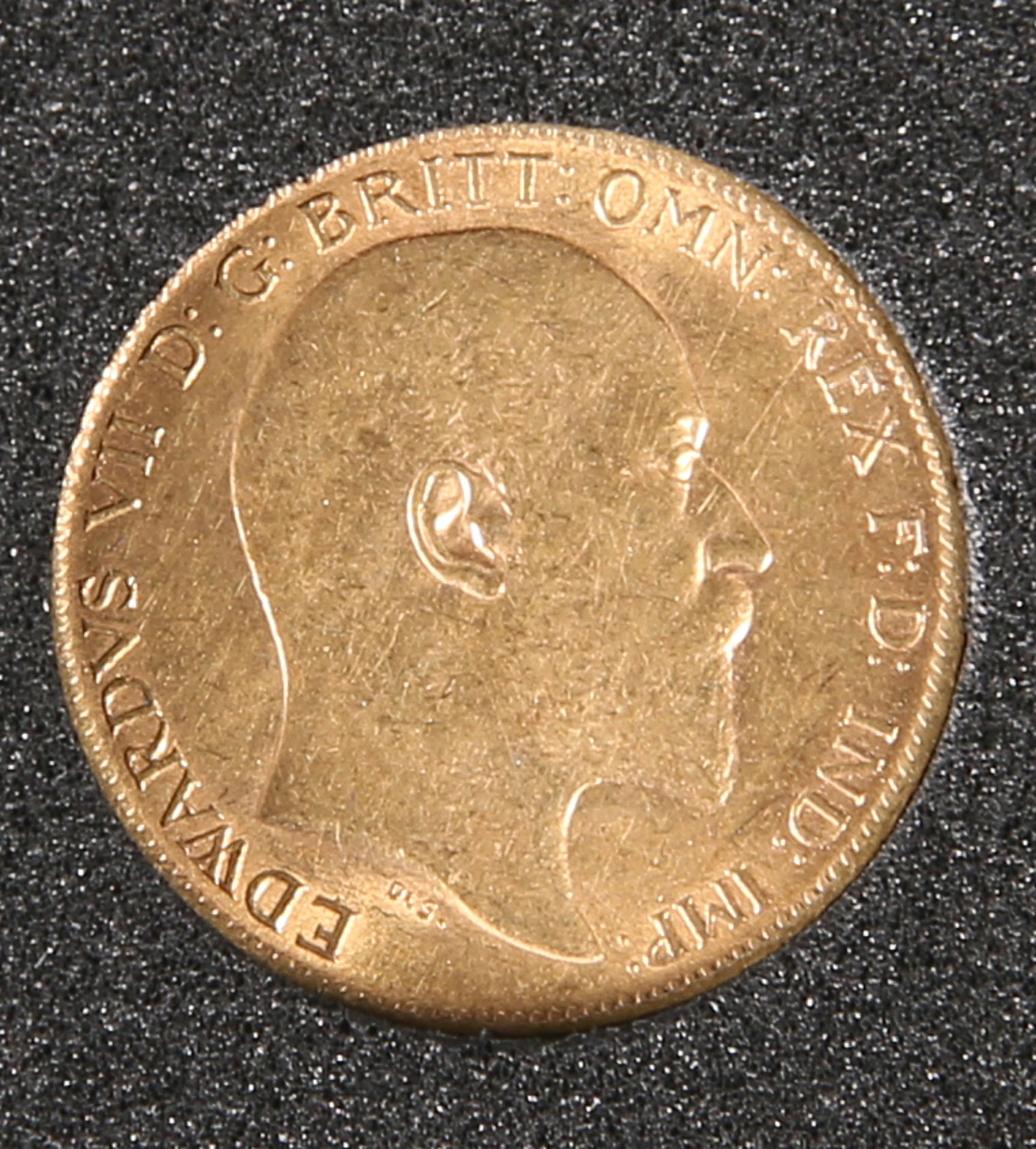 A 1910 HALF SOVEREIGN.