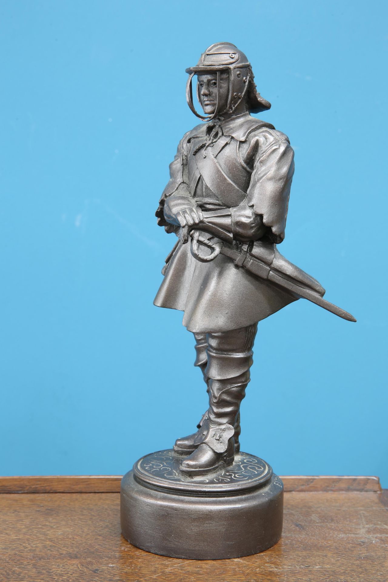 A BRONZED SCULPTURE OF A MILITARY FIGURE, signed 'Elton' and dated 1990. 29cm high