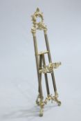 A ROCOCO STYLE BRASS EASEL. 113cm high