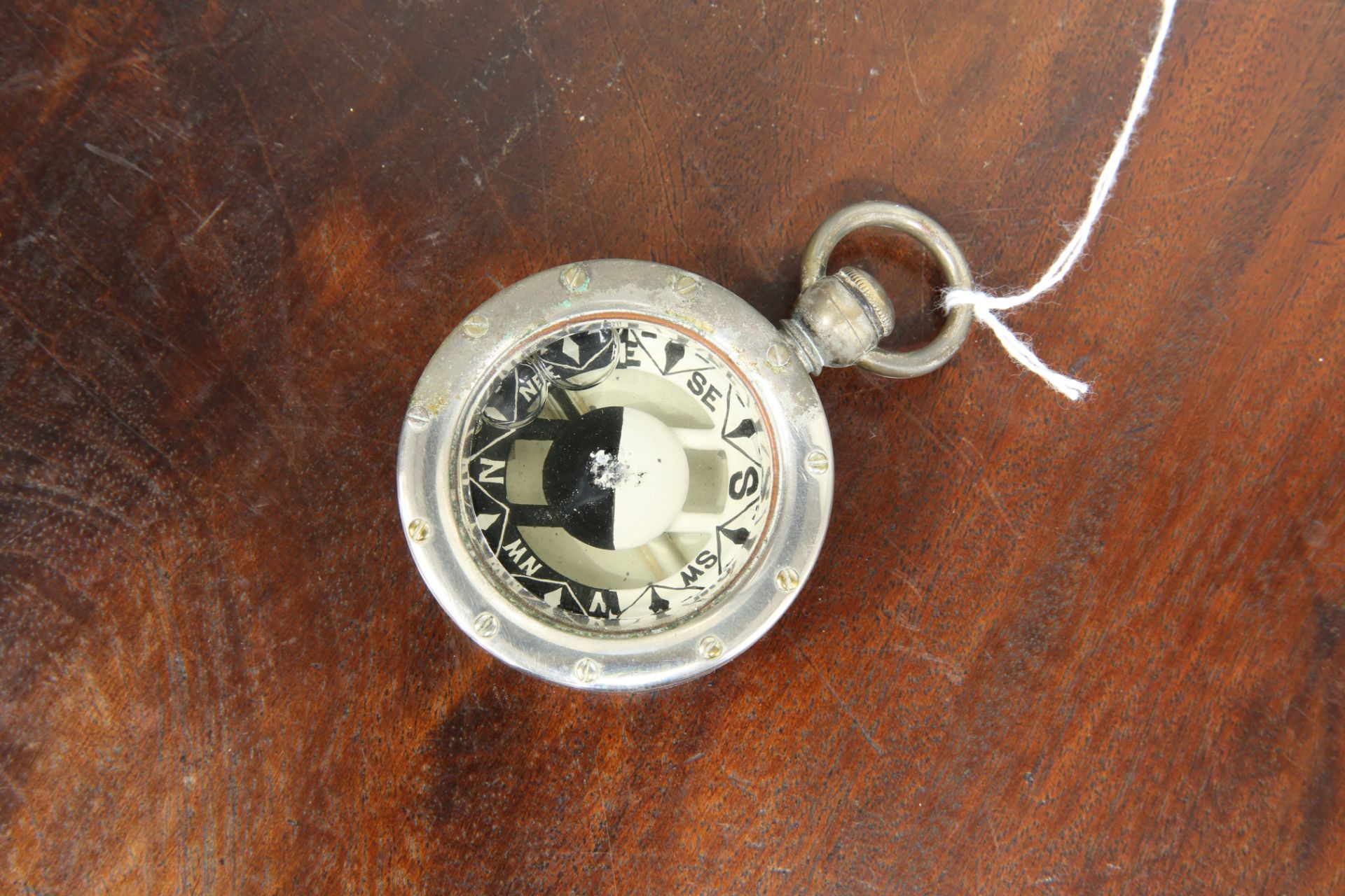 A STEEL CASED POCKET COMPASS, BY YEATES & SON, DUBLIN, in a leather case stamped 'DALKEY REGATTA - Image 2 of 4