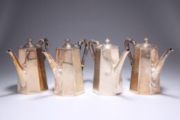 ^ A SET OF FOUR EDWARDIAN IRISH SILVER COFFEE POTS, by West & Son, Dublin 1908, of tapering