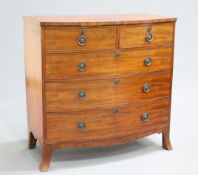 A REGENCY MAHOGANY BOW-FRONTED CHEST OF DRAWERS, the crossbanded top above two short over three long