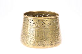 AN ISLAMIC BRONZE BOWL, with Islamic script circling the bowl and incised decoration around the