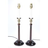 A PAIR OF BRASS MOUNTED TABLE LAMPS, turned wood fluted columns with brass acanthus leaf motif