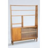 A MID CENTURY TEAK ROOM DIVIDER, with an arrangement of open shelves above a cupboard door and