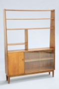 A MID CENTURY TEAK ROOM DIVIDER, with an arrangement of open shelves above a cupboard door and