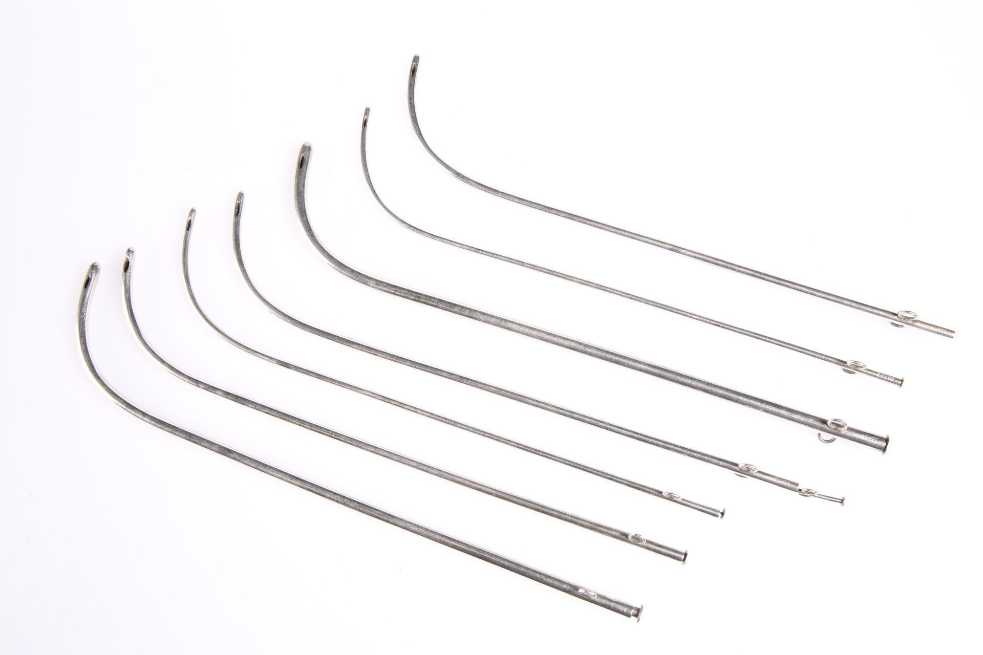 A GROUP OF SEVEN SILVER THACKRAY OF LEEDS MALE CATHETERS, each stamped silver, of tube form with