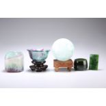 THREE PIECES OF CARVED FLUORITE, COMPRISING A BOWL on a Chinese carved wood stand, 5cm by 9.5cm; A