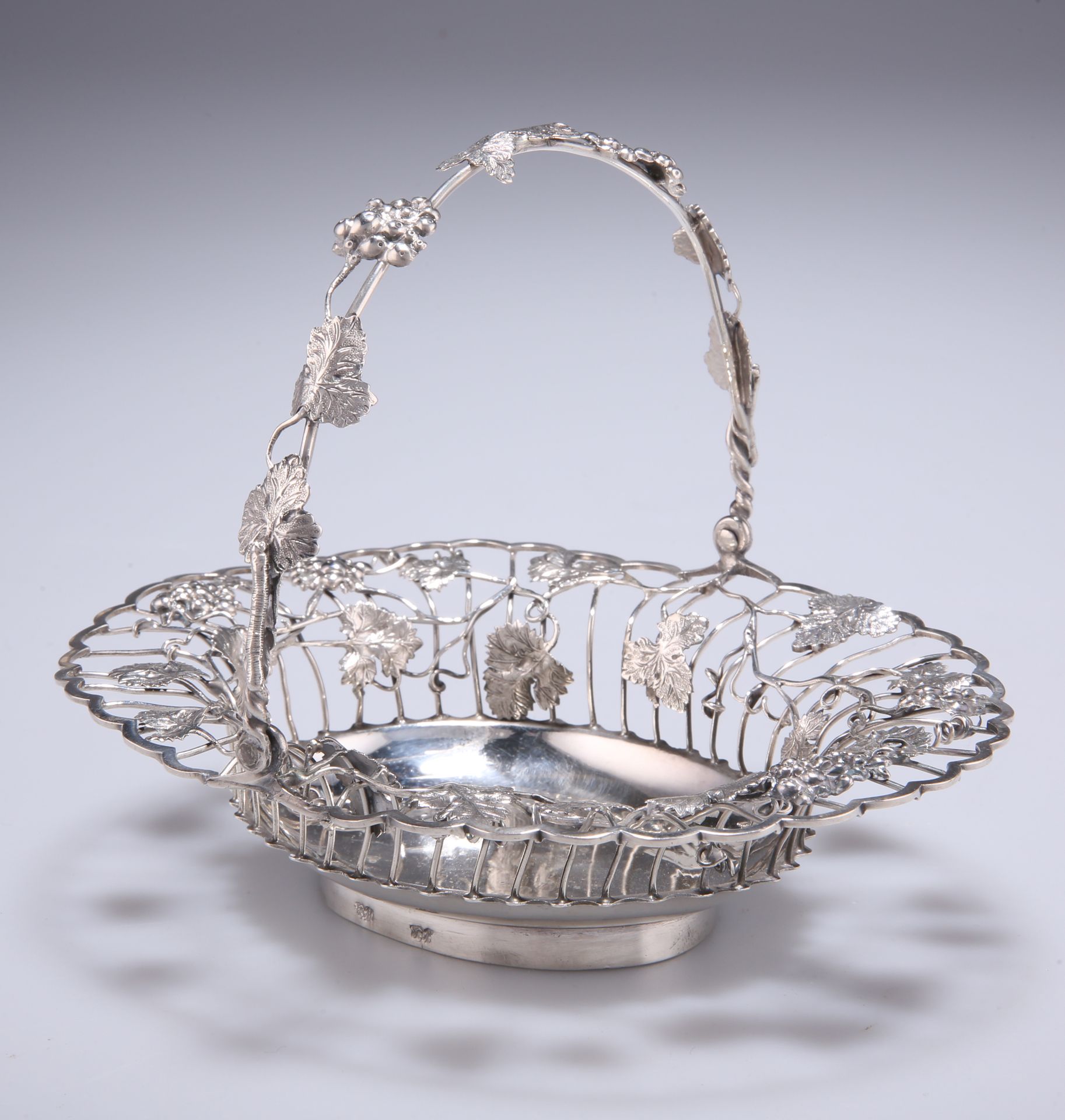 A GEORGIAN SILVER SWEETMEAT BASKET, marks rubbed, the open basket with trailing vine leaves and