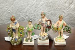 A GROUP OF FOUR PEARLWARE FIGURAL TABLE ORNAMENTS, c. 1800