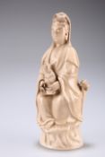 A CHINESE BLANC DE CHINE FIGURE OF GUANYIN, the Bodhisattva modelled seated at ease with long robes,