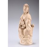 A CHINESE BLANC DE CHINE FIGURE OF GUANYIN, the Bodhisattva modelled seated at ease with long robes,