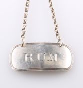 A GEORGE III SILVER RUM DECANTER LABEL, by Josiah Snatt, London 1805, label lettered RUM, with chain