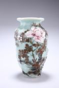A 20TH CENTURY ORIENTAL PORCELAIN VASE, moulded baluster form, painted with prunus and foliage on