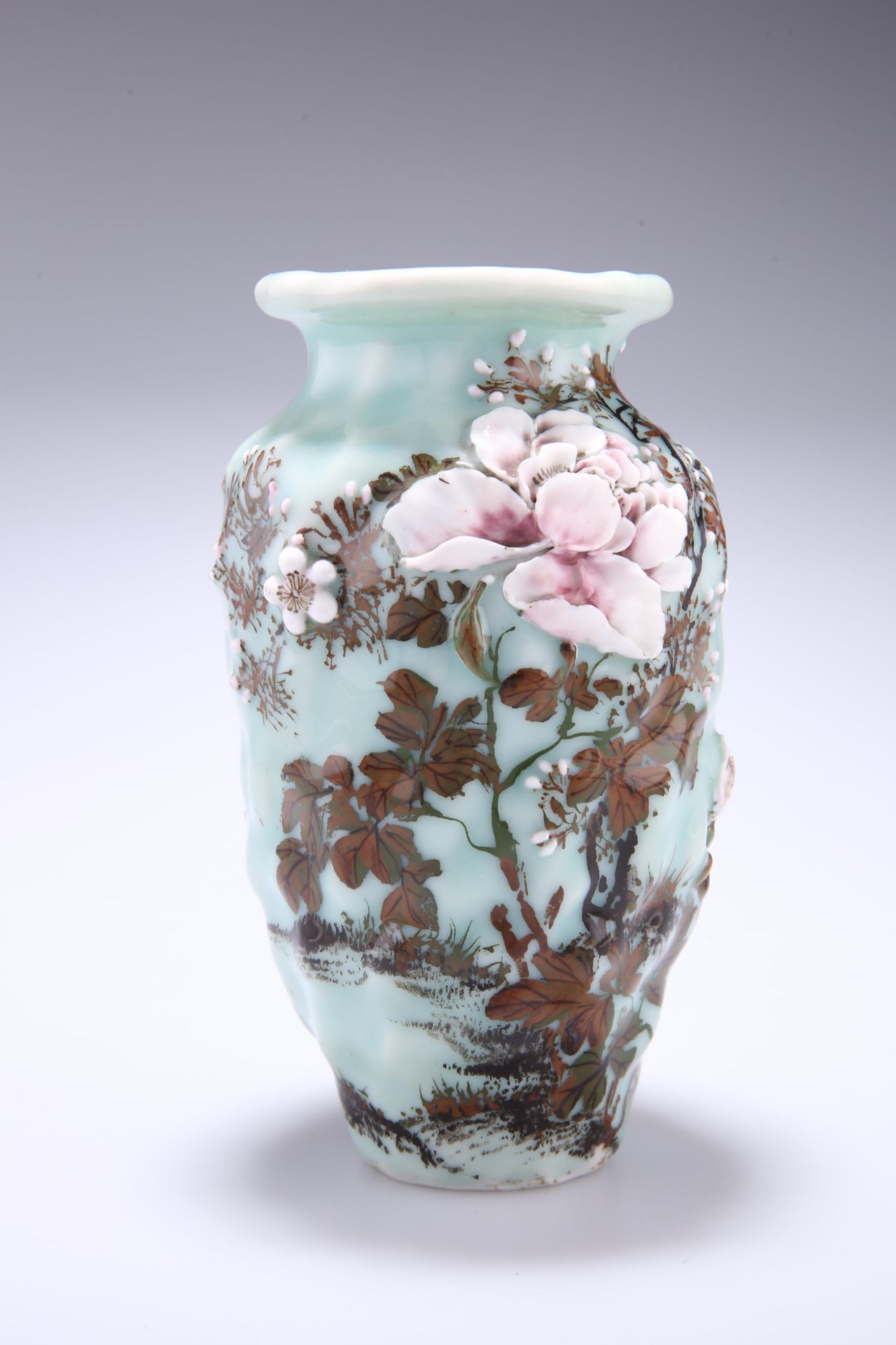 A 20TH CENTURY ORIENTAL PORCELAIN VASE, moulded baluster form, painted with prunus and foliage on