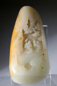 A CHINESE JADE CARVING, organic form and carved with two figures walking beneath trees. 14cm by