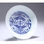 A CHINESE BLUE AND WHITE 'DOUBLE PHOENIX' SAUCER DISH, decorated to the interior with a pair of
