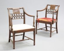 ~ A PAIR OF REGENCY MAHOGANY OPEN ARMCHAIRS, each with openwork conjoined strapwork back panel and