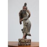 A LARGE CHINESE CARVED, PAINTED AND GILDED FIGURE modelled standing in flowing robes. 89.5cm high